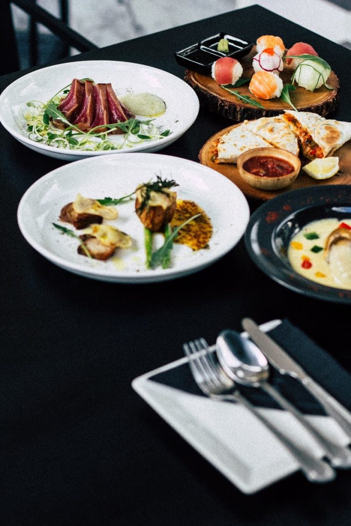 roasted meat served on white ceramic plates